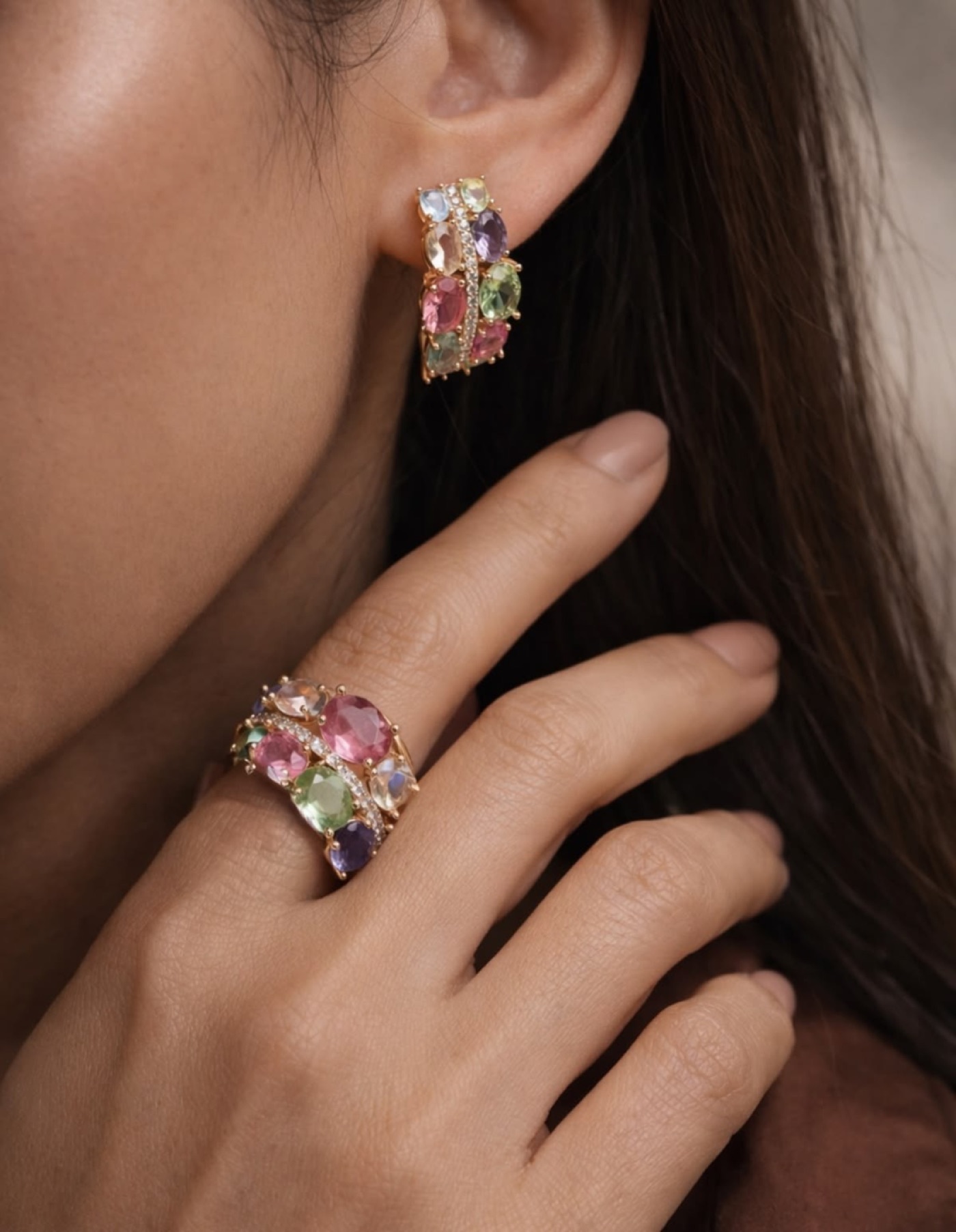 Opulesse coloured gemstone earring and ring, worn close to the ear and hand